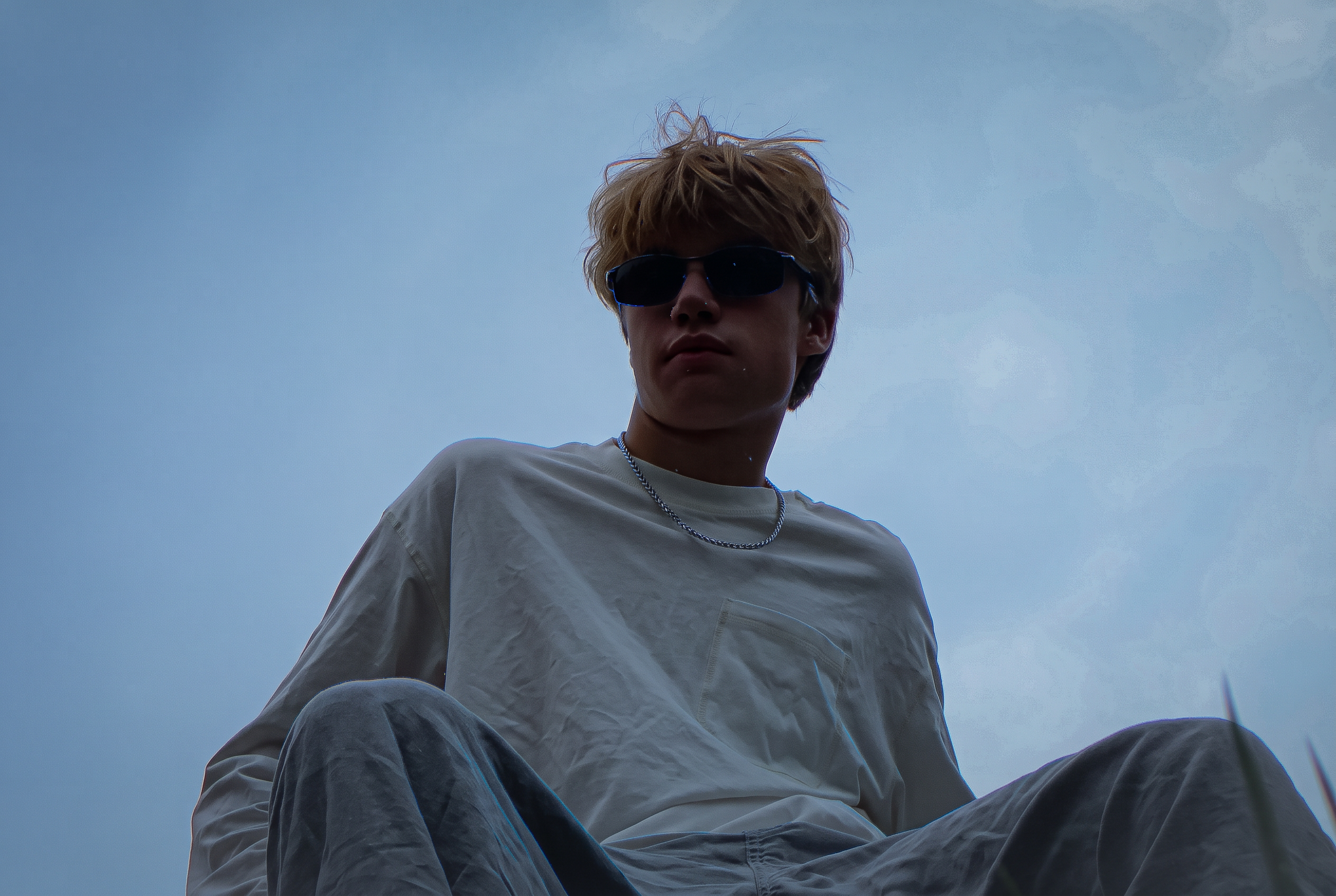 Low-angle portrait of It'z 1uk3 wearing sunglasses