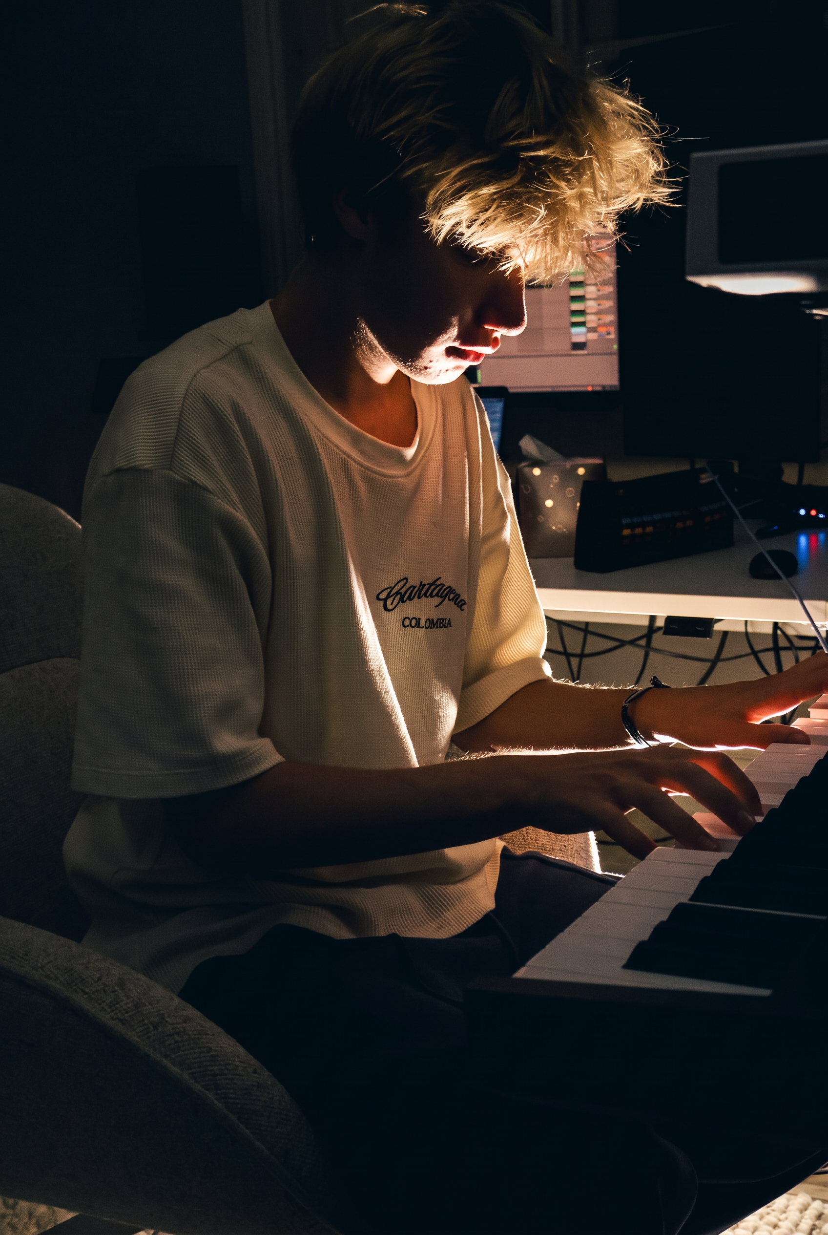 It'z 1uk3 composing at the keyboard in his studio